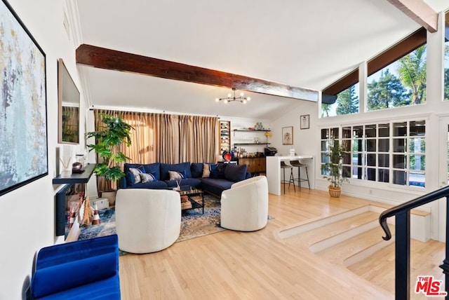 living room with hardwood / wood-style flooring, vaulted ceiling with beams, and a chandelier