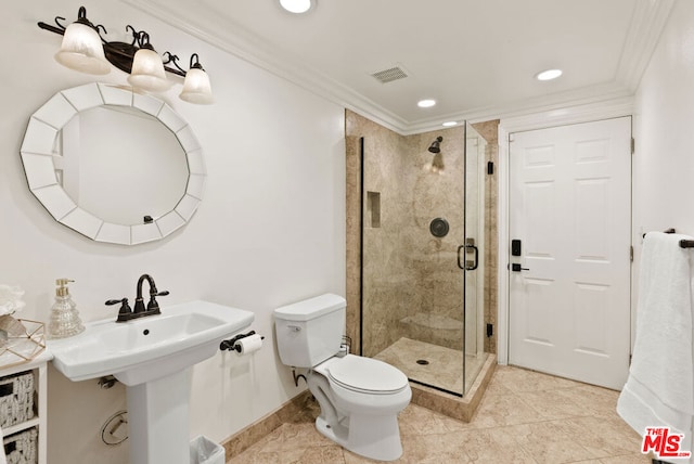 bathroom with crown molding, toilet, and a shower with shower door