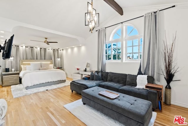 bedroom featuring lofted ceiling with beams, a chandelier, and light hardwood / wood-style flooring