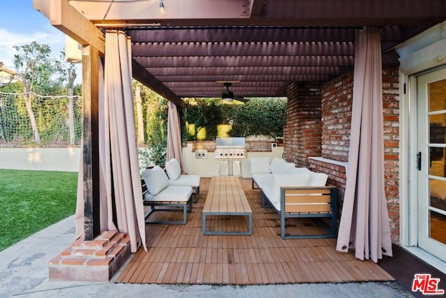 view of patio / terrace with ceiling fan, area for grilling, a grill, and outdoor lounge area