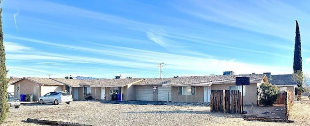 single story home with a garage