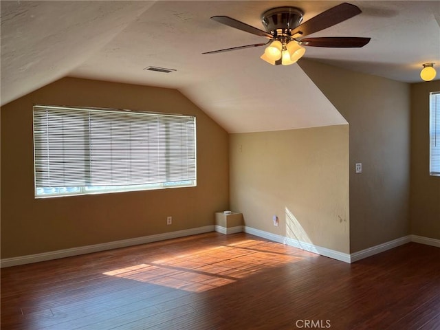 bonus room with wood-type flooring, lofted ceiling, and ceiling fan