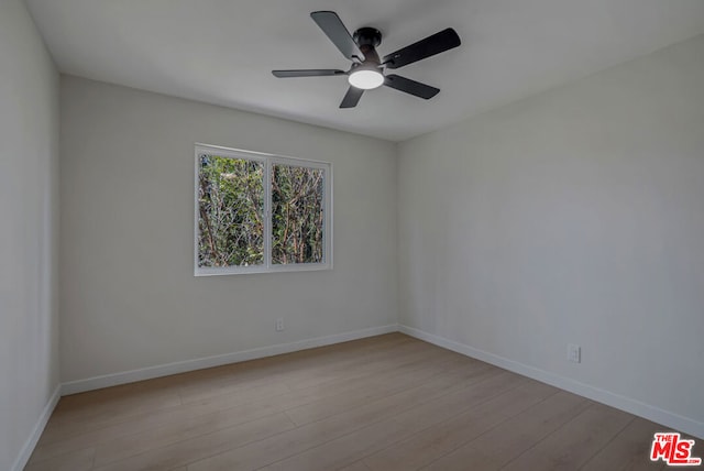 spare room with ceiling fan and light hardwood / wood-style flooring