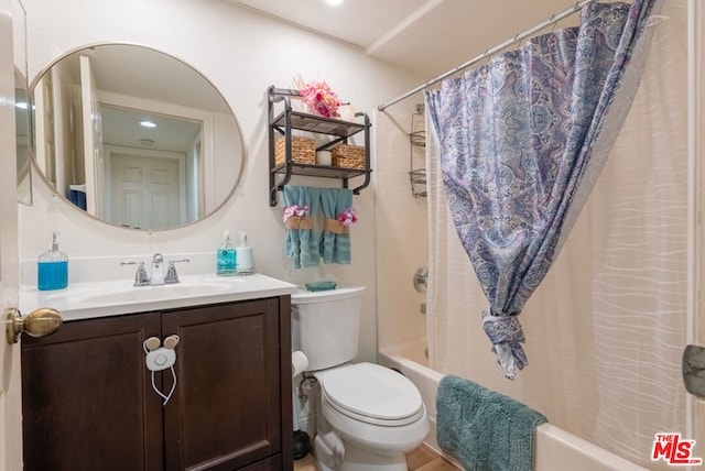 full bathroom with vanity, toilet, and shower / bath combo with shower curtain