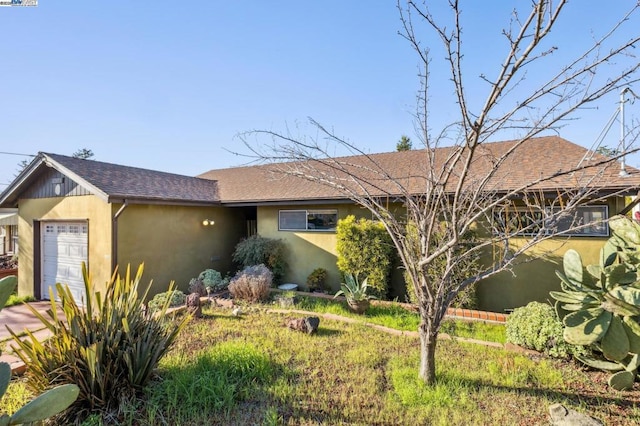 ranch-style home with a garage