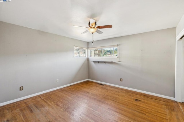 unfurnished room featuring wood-type flooring and ceiling fan