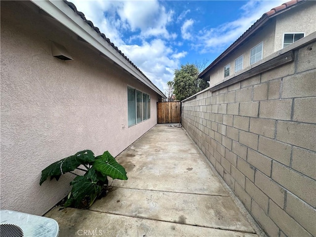 view of side of property featuring a patio area