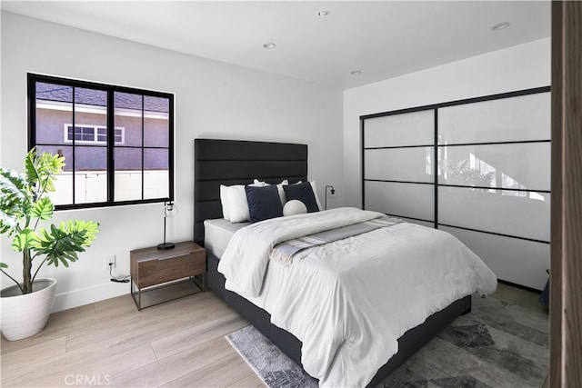 bedroom with light wood-type flooring