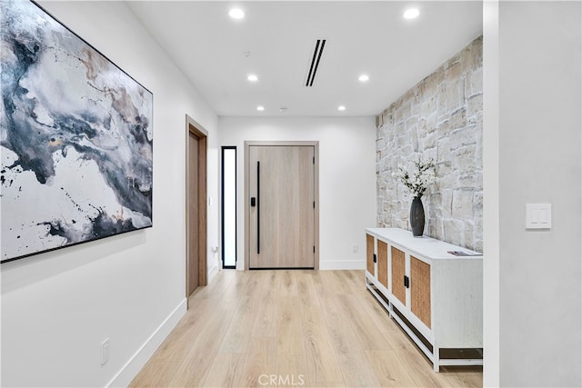 corridor featuring light hardwood / wood-style floors