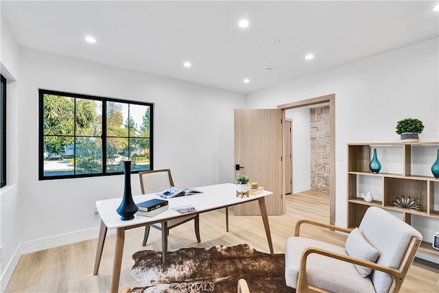 office with light hardwood / wood-style floors