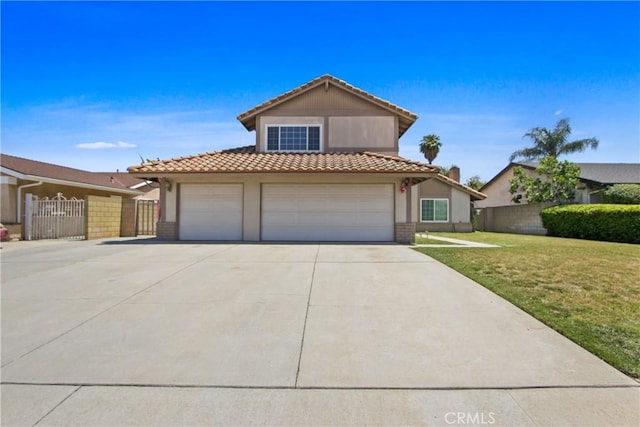 traditional home with a tiled roof, fence, a front lawn, concrete driveway, and stucco siding