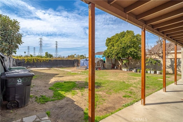 view of yard featuring a pool and a patio