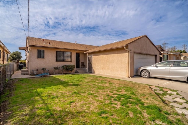 ranch-style home with a garage and a front lawn