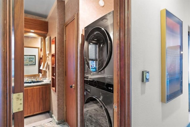 laundry room featuring stacked washer and clothes dryer