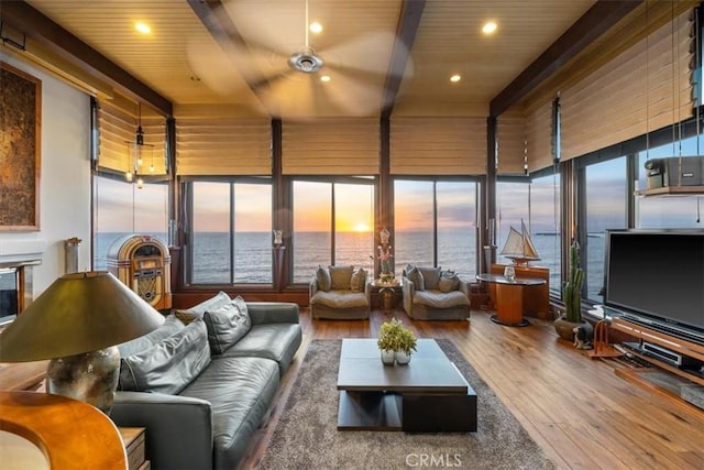 sunroom featuring wooden ceiling and beamed ceiling