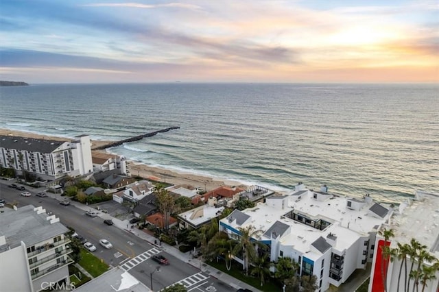 aerial view at dusk with a water view