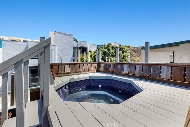 view of swimming pool featuring a deck