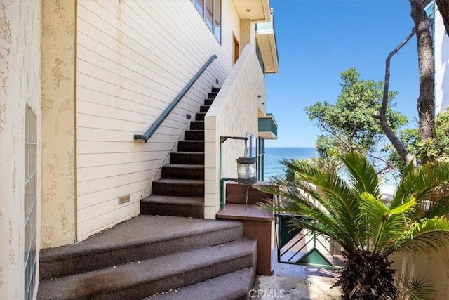 stairway with a water view