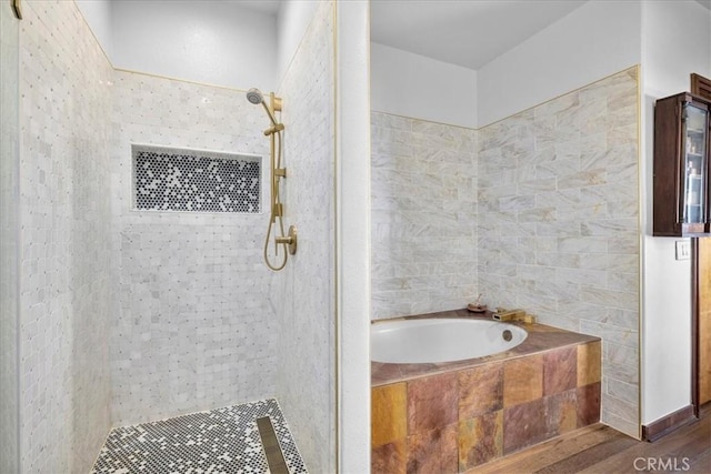 bathroom featuring hardwood / wood-style floors and shower with separate bathtub