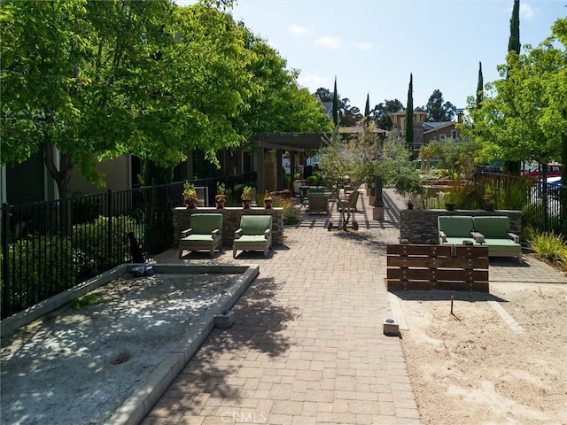 view of home's community featuring an outdoor living space, a pergola, and a patio area