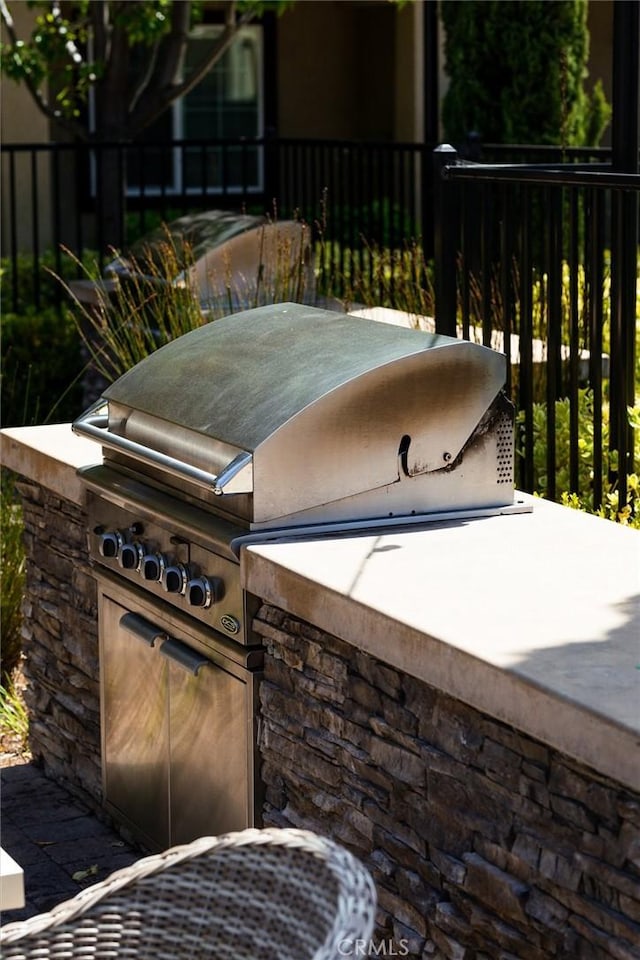 view of patio / terrace featuring area for grilling and exterior kitchen