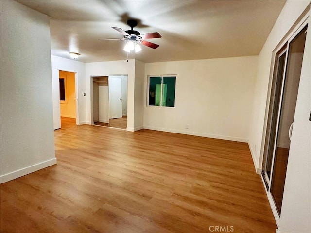 interior space with hardwood / wood-style flooring and ceiling fan