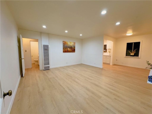 unfurnished living room featuring light wood-type flooring