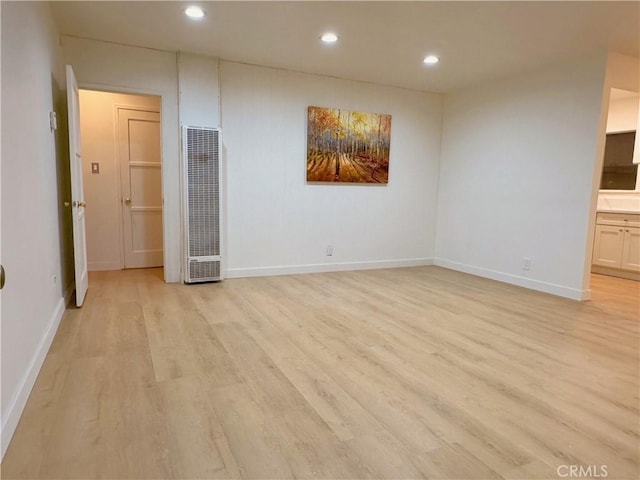 empty room with light wood-type flooring