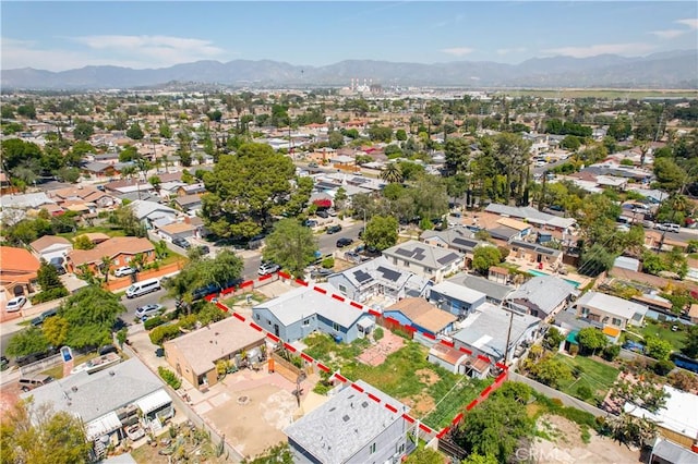 drone / aerial view featuring a residential view and a mountain view