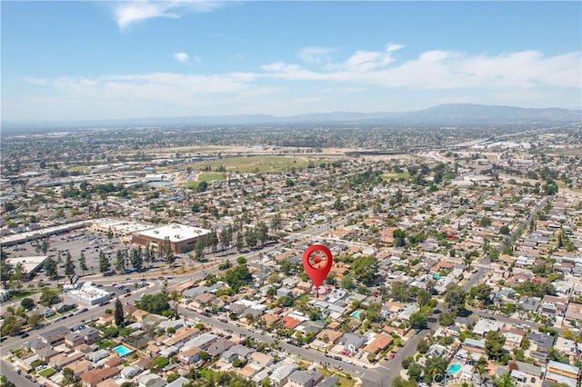 birds eye view of property with a mountain view