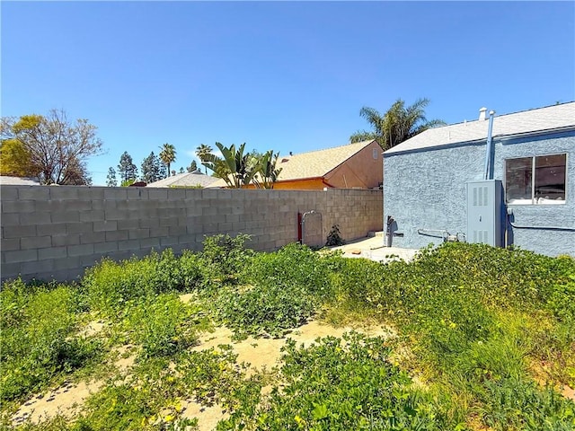 view of yard with a fenced backyard