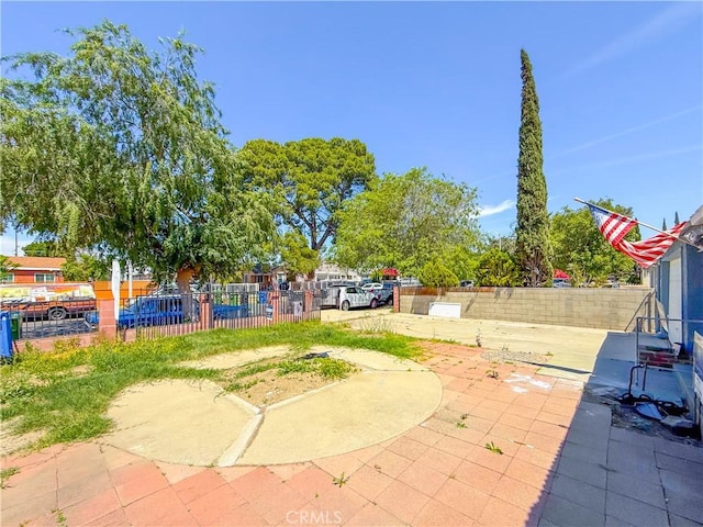 view of patio / terrace featuring fence