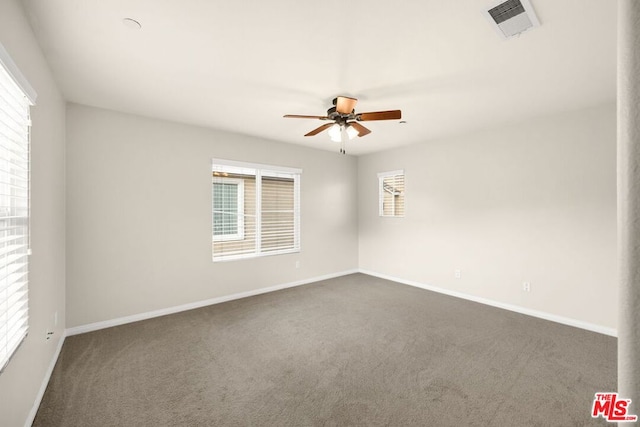 carpeted empty room featuring ceiling fan