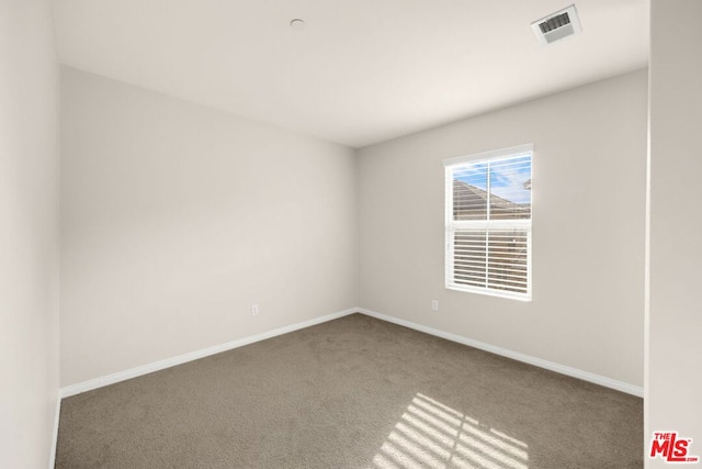 empty room featuring carpet floors