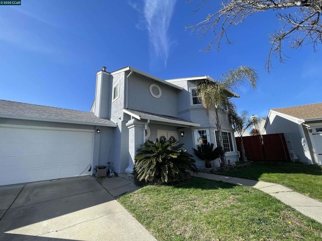 view of front property with a garage and a front yard