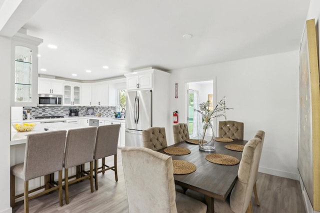 dining room featuring light wood-type flooring