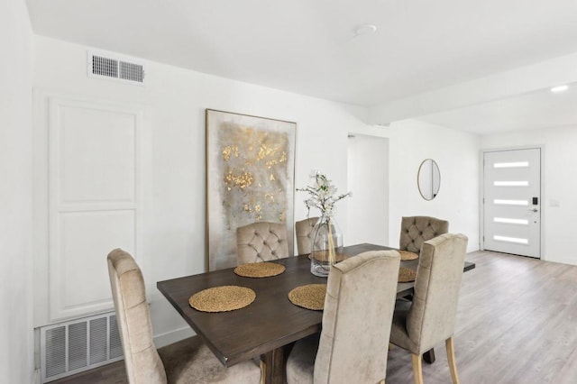 dining space featuring hardwood / wood-style floors