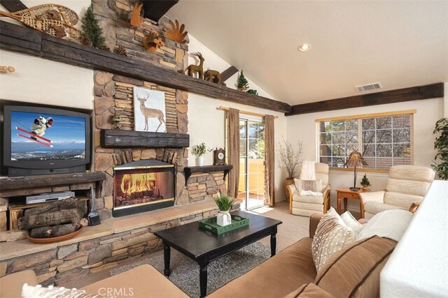 carpeted living room with lofted ceiling and a stone fireplace