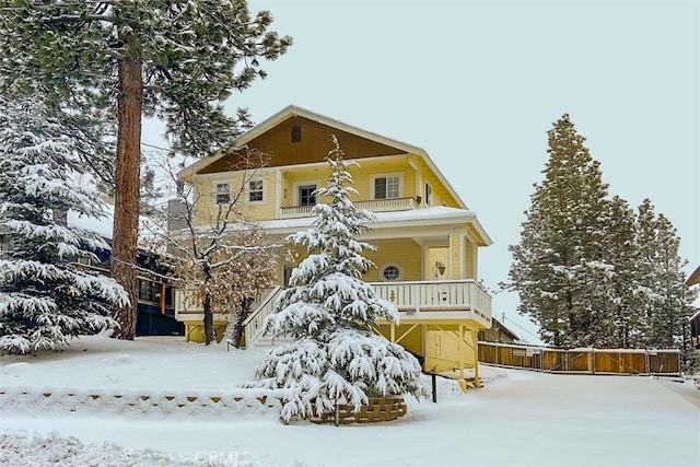 view of front of home with a balcony and a porch