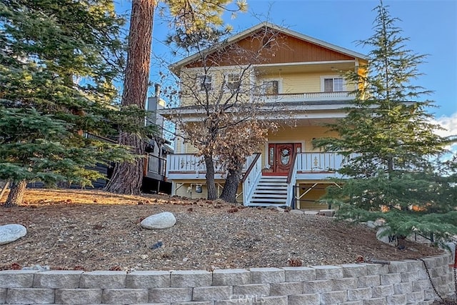 view of front of house featuring a porch and stairway