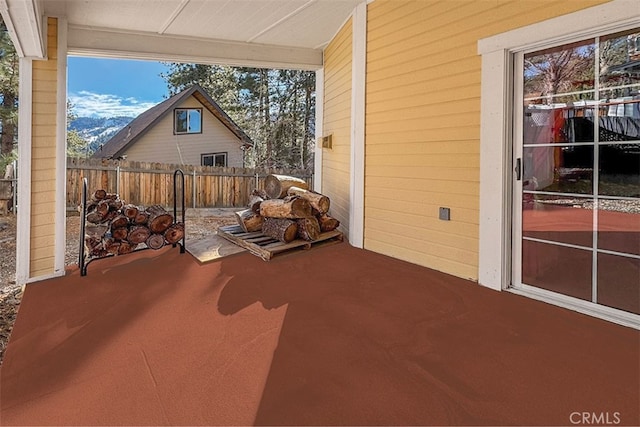 view of patio featuring fence