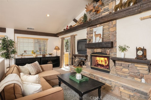 living area with lofted ceiling, a fireplace, and visible vents