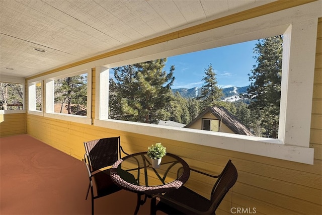 sunroom with a mountain view