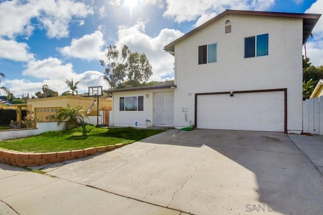 view of front of home with a garage and a front yard