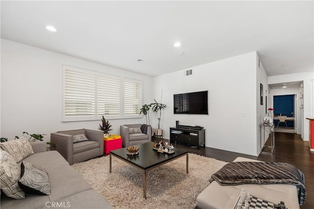 living room with dark hardwood / wood-style floors