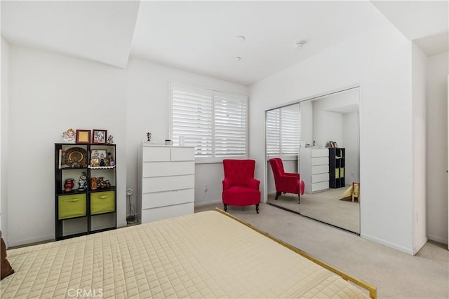 carpeted bedroom with a closet