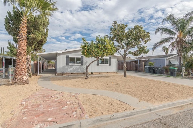 view of front of home with a carport