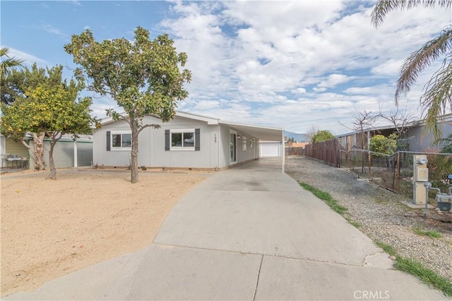 view of front facade with a garage and a carport