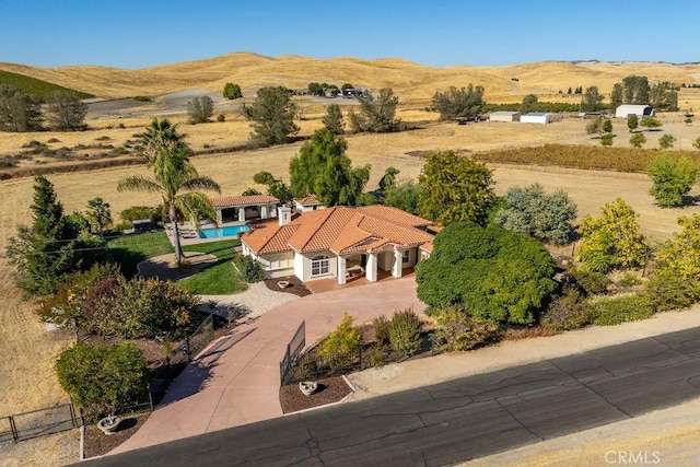 bird's eye view with a mountain view and a rural view