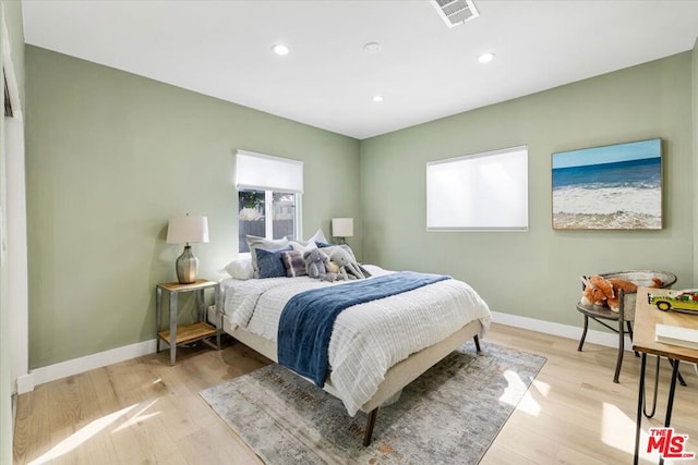 bedroom featuring light hardwood / wood-style floors